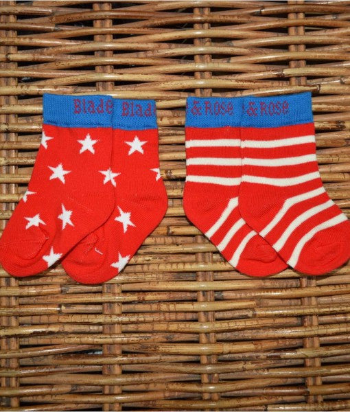Red, Blue and White socks with stripe and star patterns
